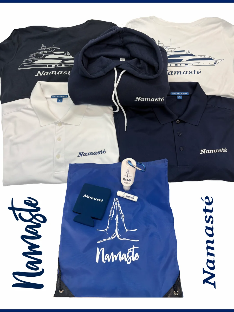 Namasté-branded yacht apparel and promo items from Goldcoast Marketing Group, including tees, polos, a hoodie, and a drawstring bag gift set
